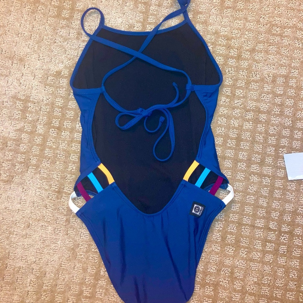 This is a Gavin 26 multi color Jolyn onesie brand new! Never been used